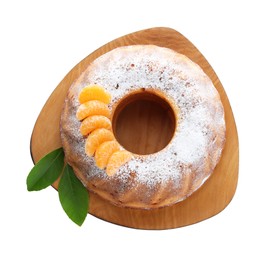 Homemade yogurt cake with tangerines, powdered sugar and green leaves on white background, top view