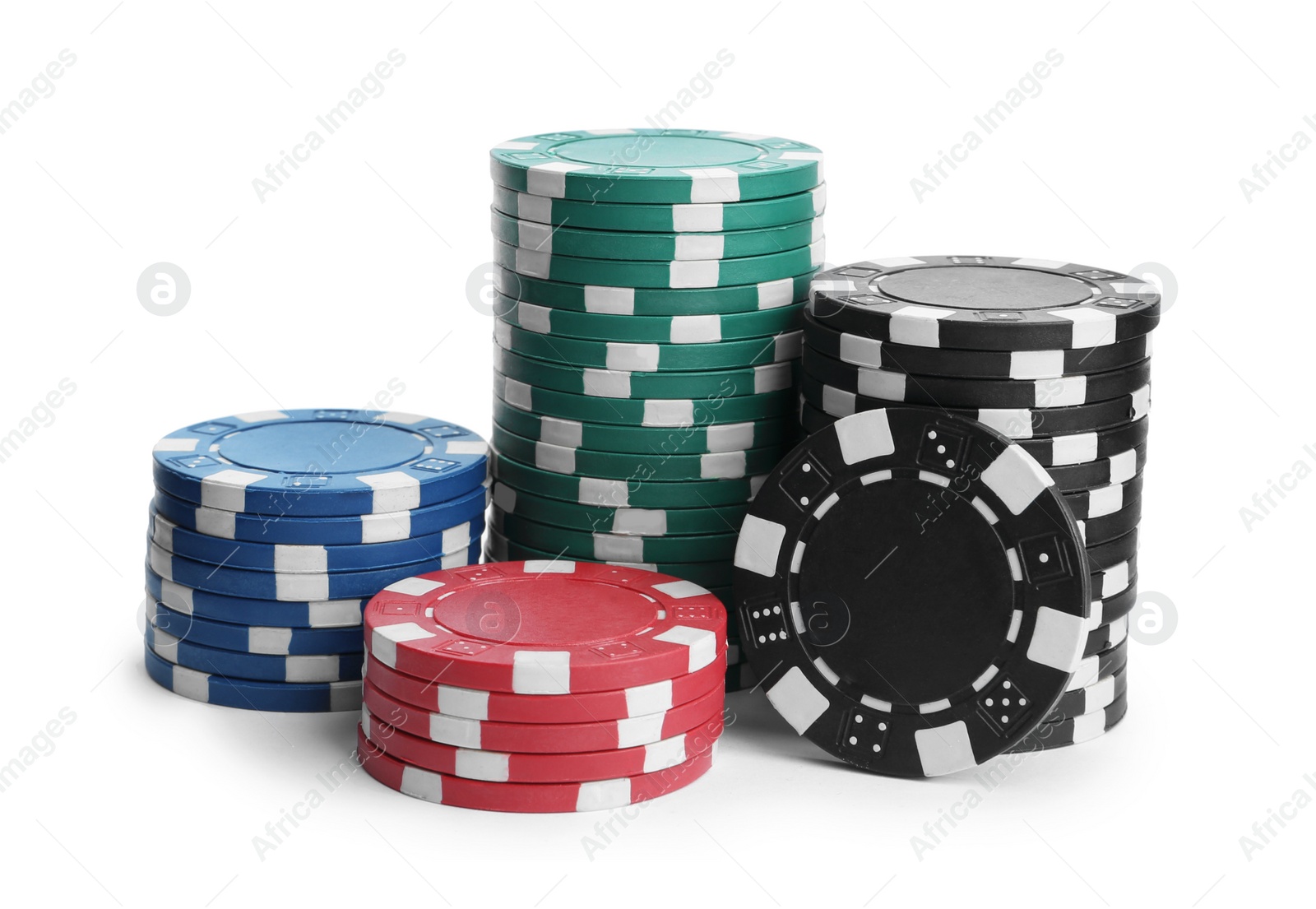 Photo of Plastic casino chips stacked on white background. Poker game