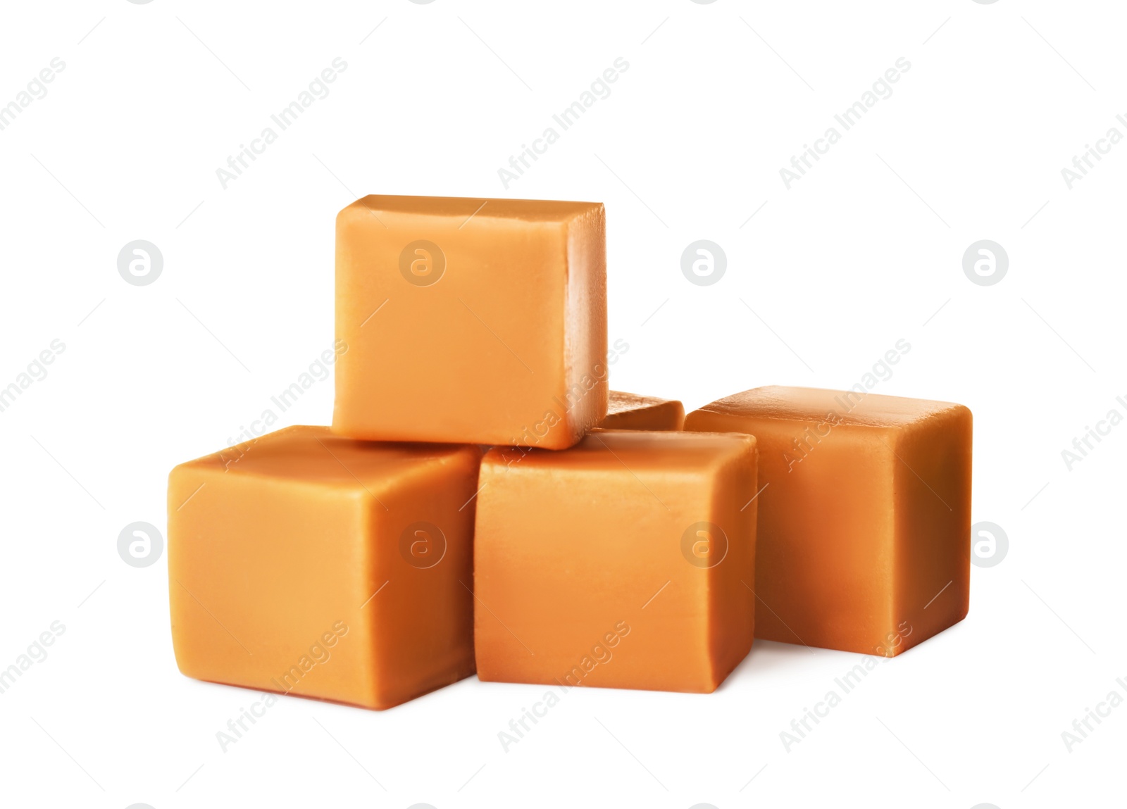 Photo of Heap of caramel candies on white background