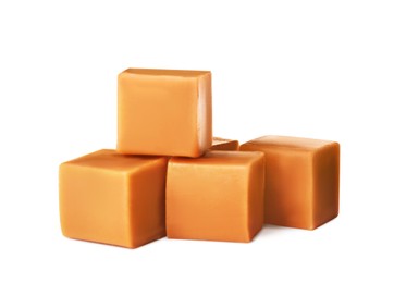 Photo of Heap of caramel candies on white background