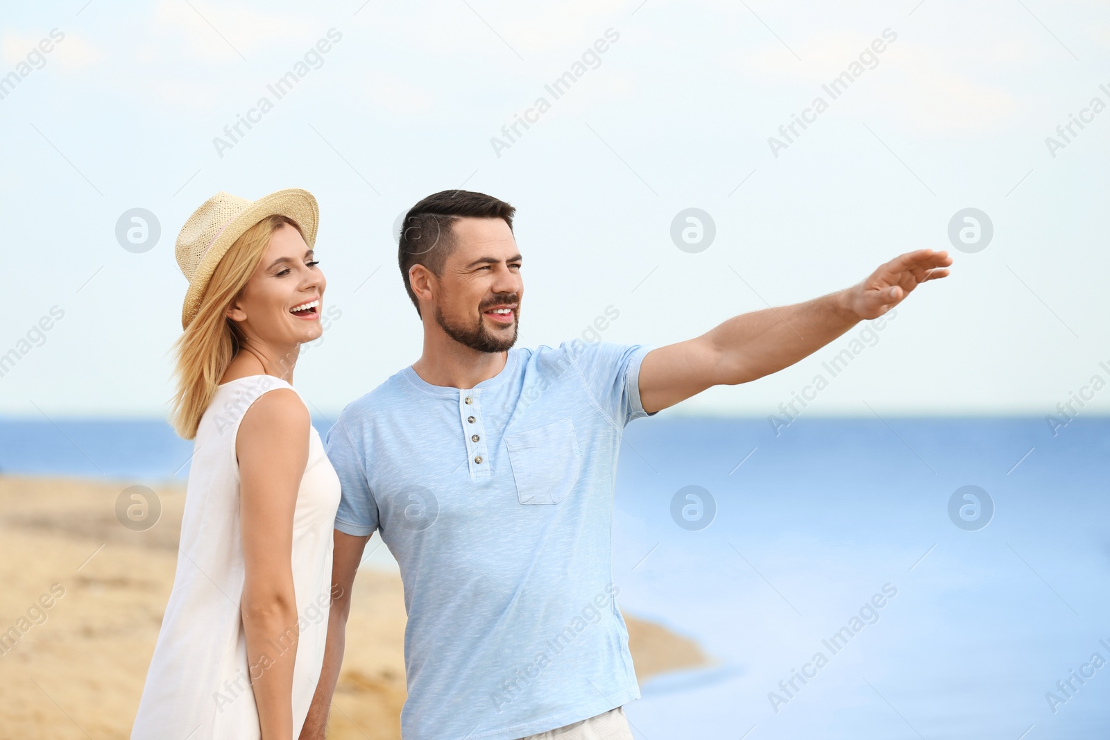 Photo of Happy romantic couple spending time together on beach