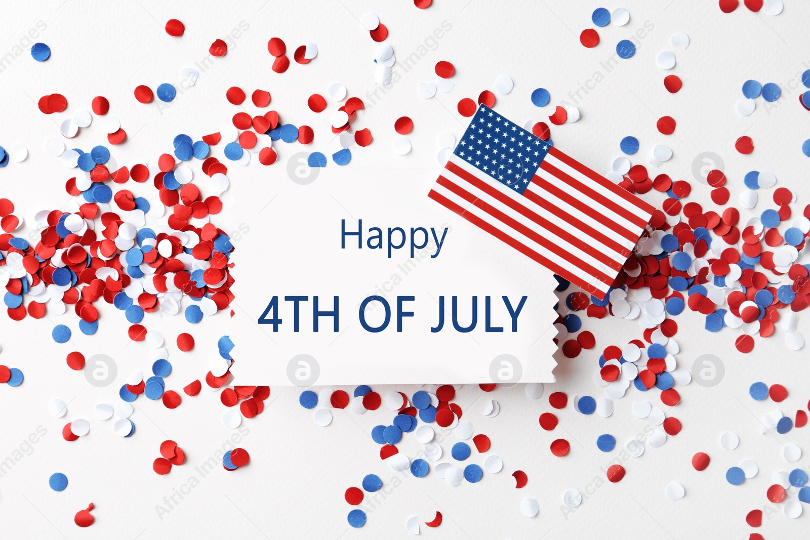 Photo of Flat lay composition with greeting card, USA flag and confetti on white background. Happy Independence Day