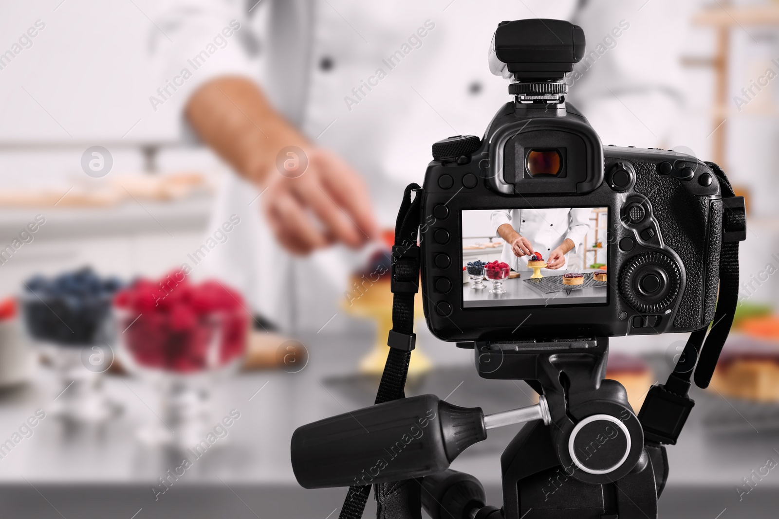 Image of Food photography. Shooting of chef decorating dessert, focus on camera