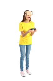 Young woman using cardboard virtual reality headset, isolated on white