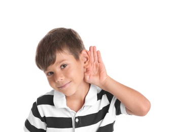 Cute little boy with hearing problem on white background