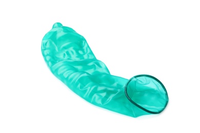 Green used condom on white background. Safe sex concept