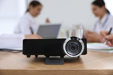 Video projector on table during medical conference