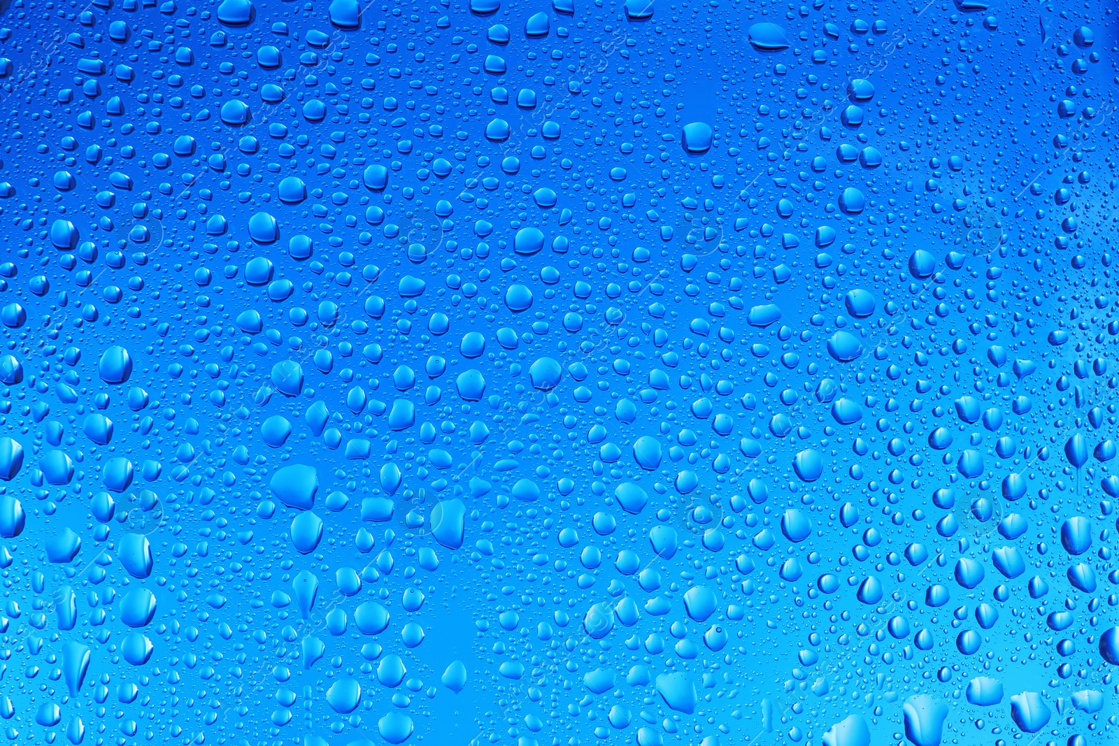 Photo of View of glass with water drops, closeup