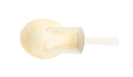 Photo of Pile of gelatin powder and scoop on white background, top view