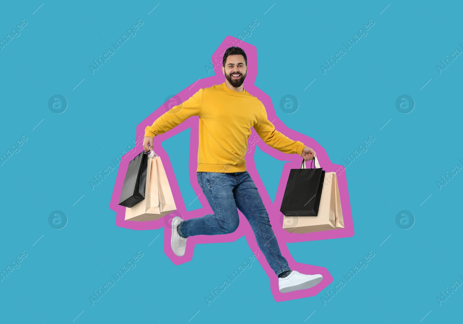 Image of Happy man with shopping bags jumping on light blue background