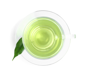 Photo of Cup of aromatic green tea and leaf isolated on white, top view