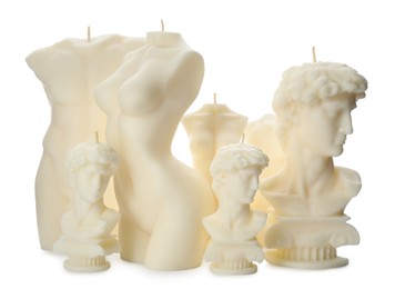 Photo of Collection of beautiful sculptural candles on white background