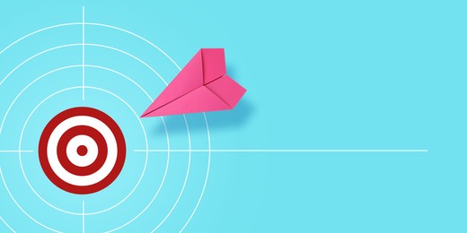 Image of Target achievement. Paper plane heading to bullseye on light blue background, banner design