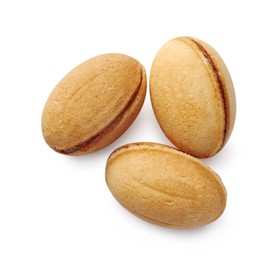 Photo of Delicious nut shaped cookie with boiled condensed milk on white background, top view