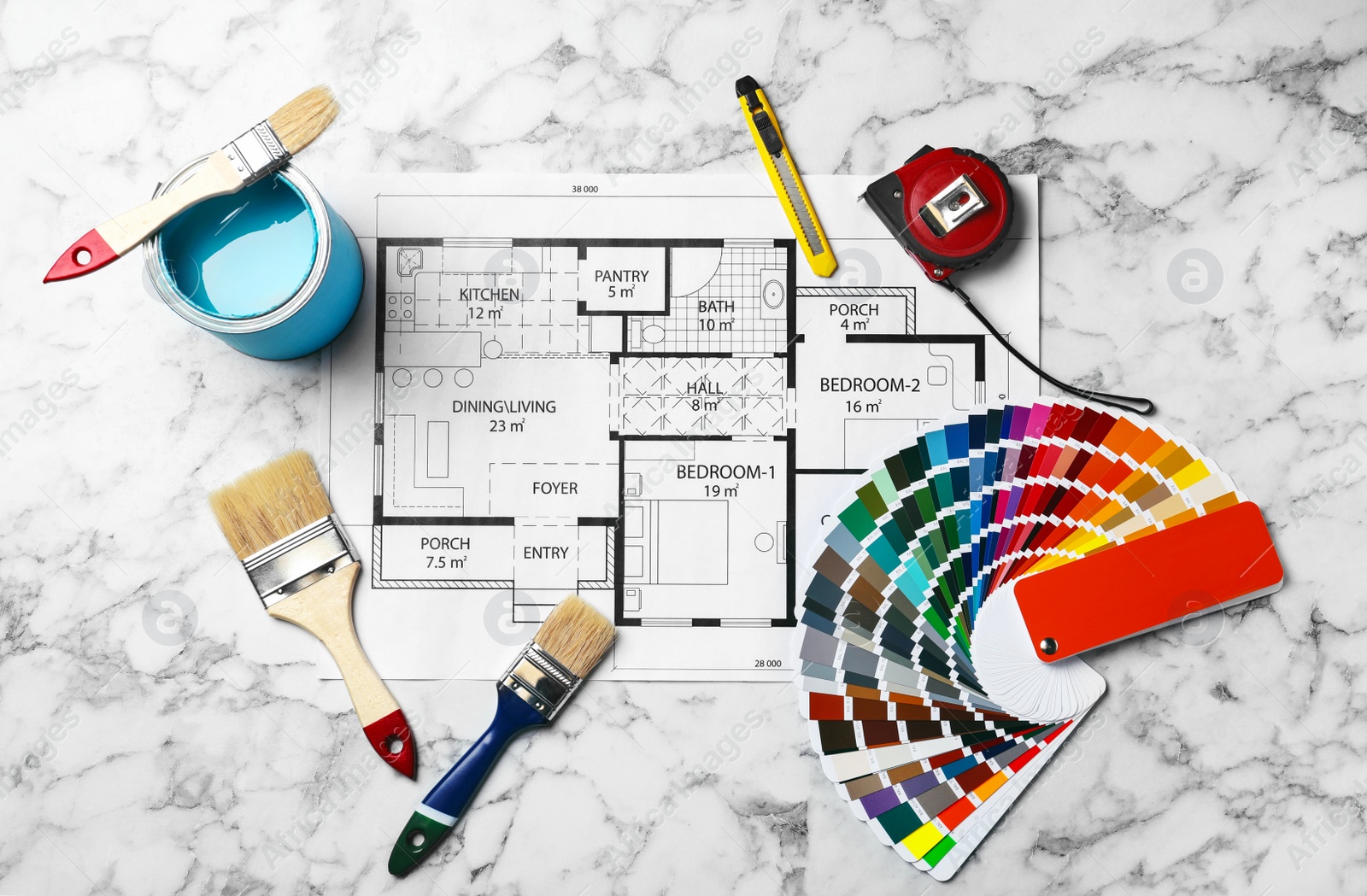 Photo of Set of decorator's tools and project drawing on light background, flat lay