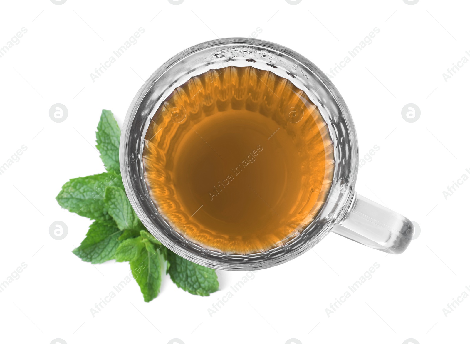 Photo of Cup with hot aromatic mint tea isolated on white, top view