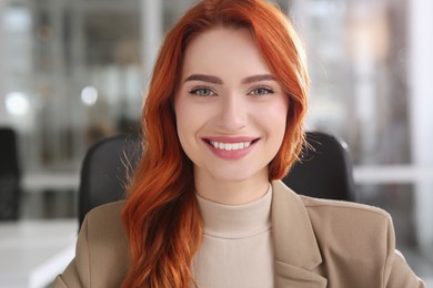 Photo of Happy woman having video call in office, view from web camera