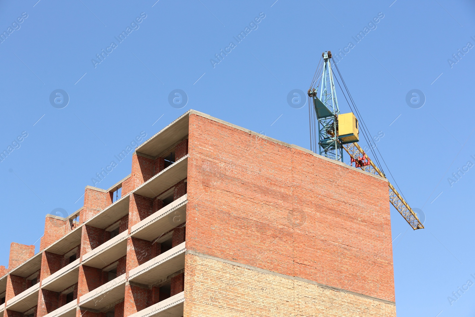 Photo of View of unfinished building against blue sky