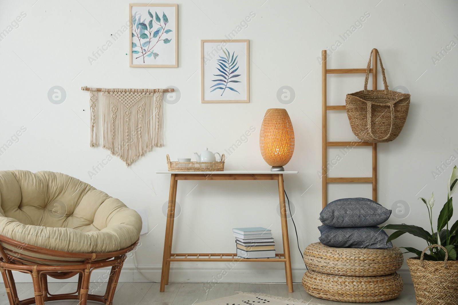 Photo of Living room interior design with comfortable papasan chair and wooden table