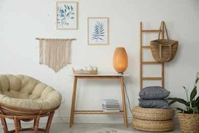 Living room interior design with comfortable papasan chair and wooden table