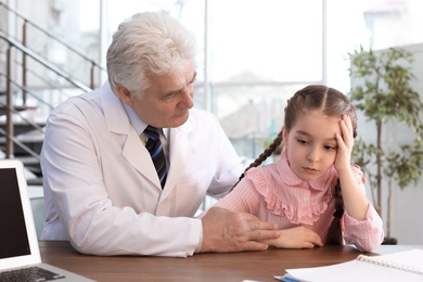 Photo of Little girl having appointment at child psychologist office