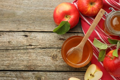 Sweet honey and fresh apples on wooden table, flat lay. Space for text