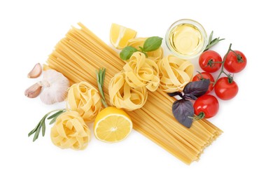 Different types of pasta and ingredients on white background, top view