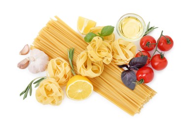 Photo of Different types of pasta and ingredients on white background, top view