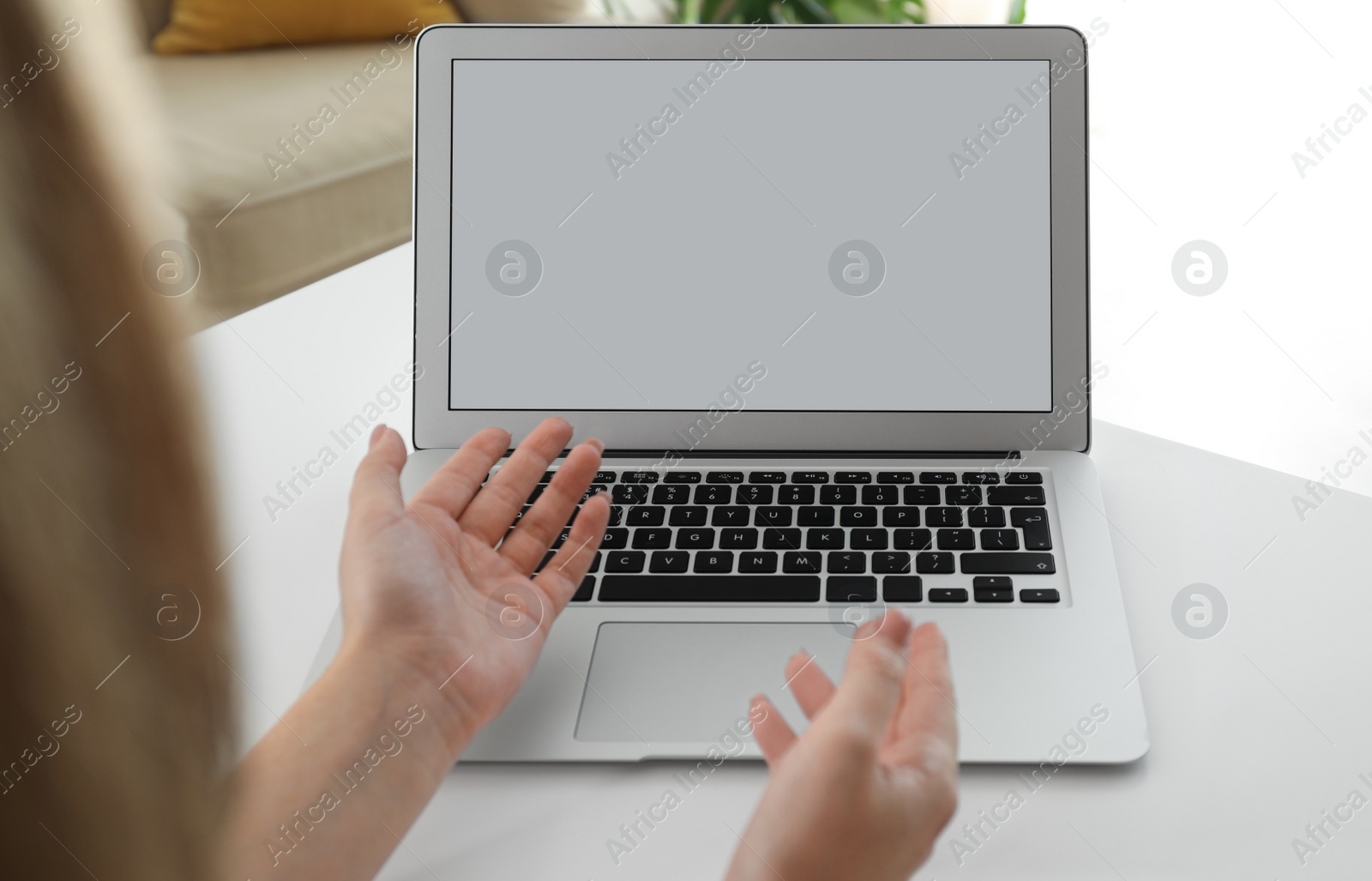 Photo of Coworkers working together online. Woman using video chat on laptop, closeup