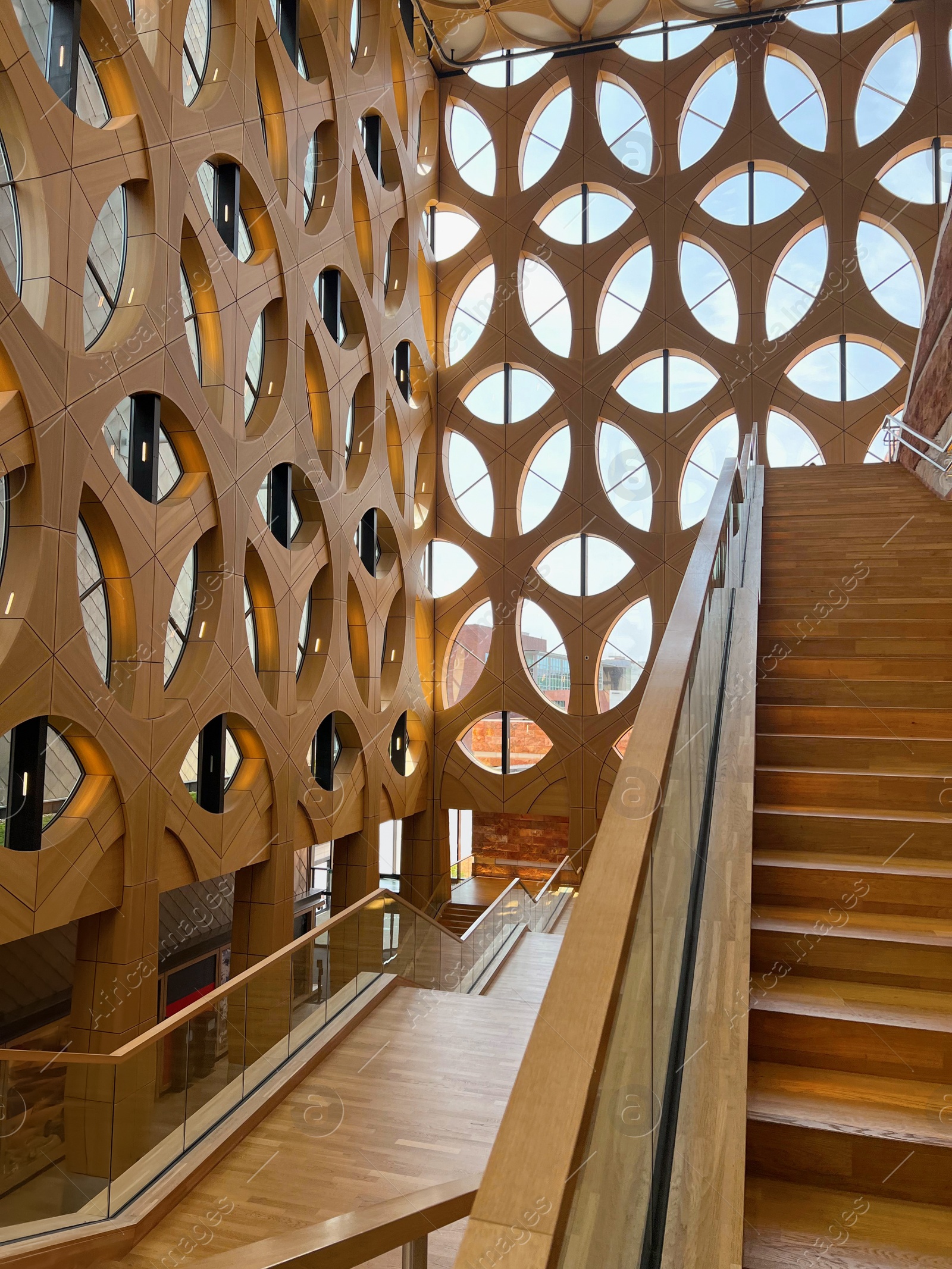 Photo of Decorative wooden pattern covering wall and ceiling in building