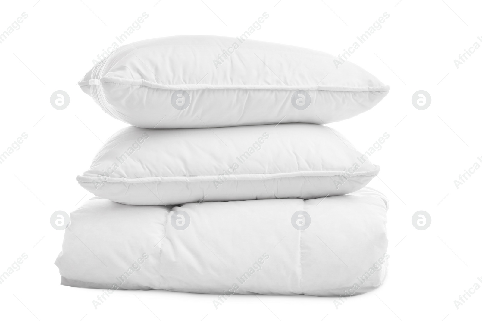 Photo of Soft blanket with pillows on white background