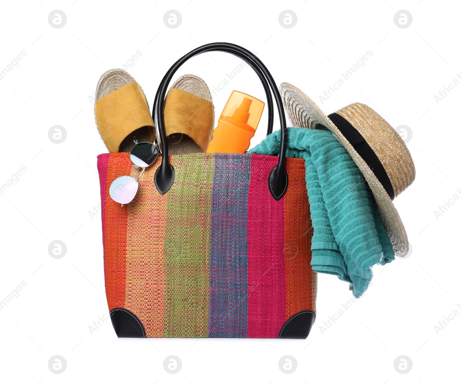 Photo of Stylish bag with beach accessories isolated on white