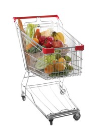 Shopping cart with fresh groceries on white background