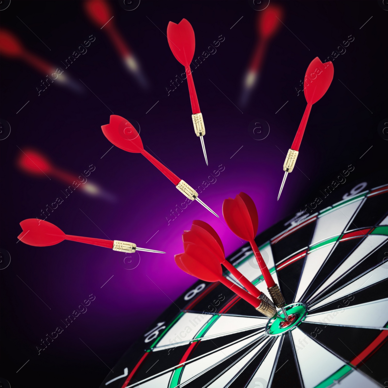 Image of Board and darts on dark violet background