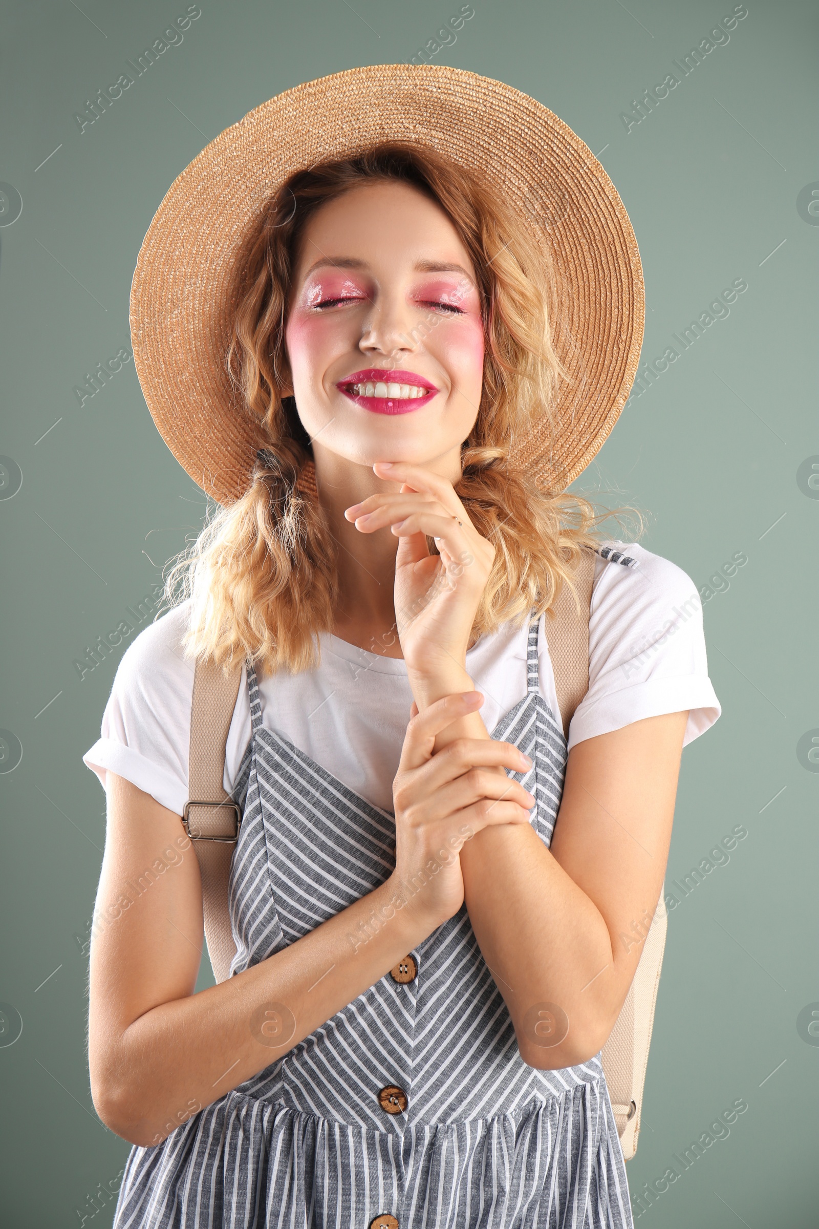 Photo of Beautiful young woman posing on color background. Summer fashion