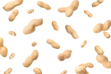 Image of Unpeeled peanuts in air on white background