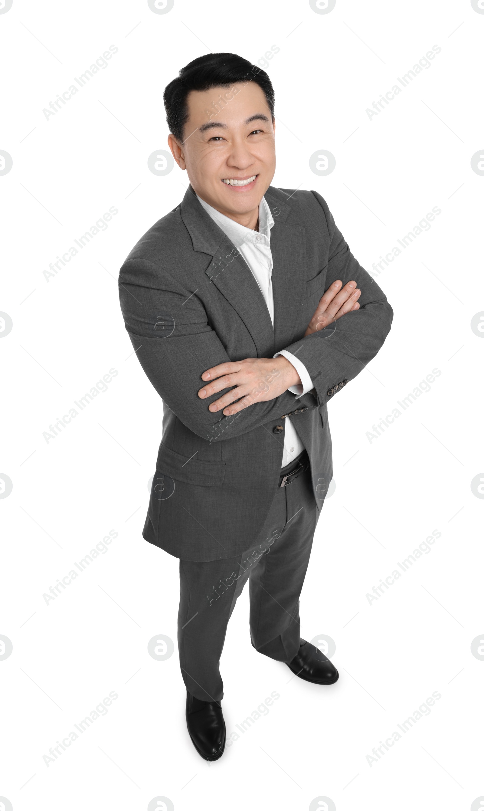 Photo of Businessman in suit posing on white background, above view