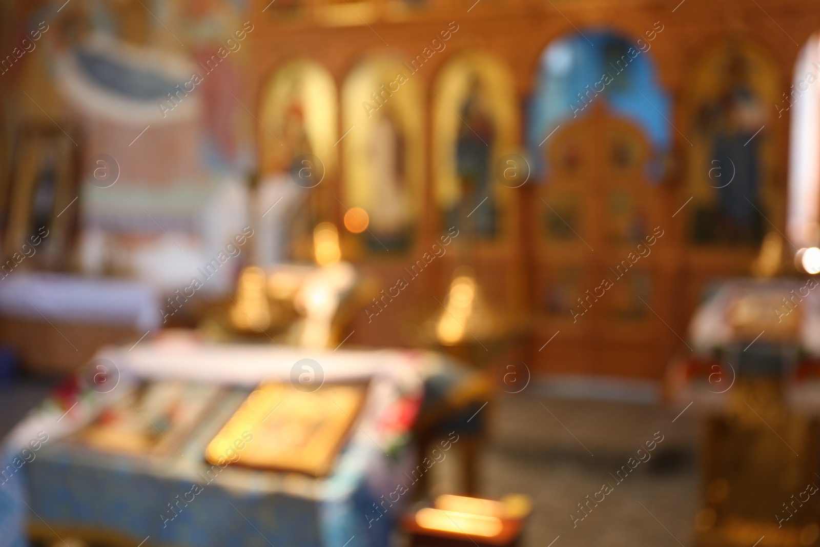 Photo of Blurred view of beautiful church interior with ecclesiastical icons