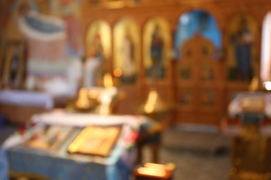 Blurred view of beautiful church interior with ecclesiastical icons