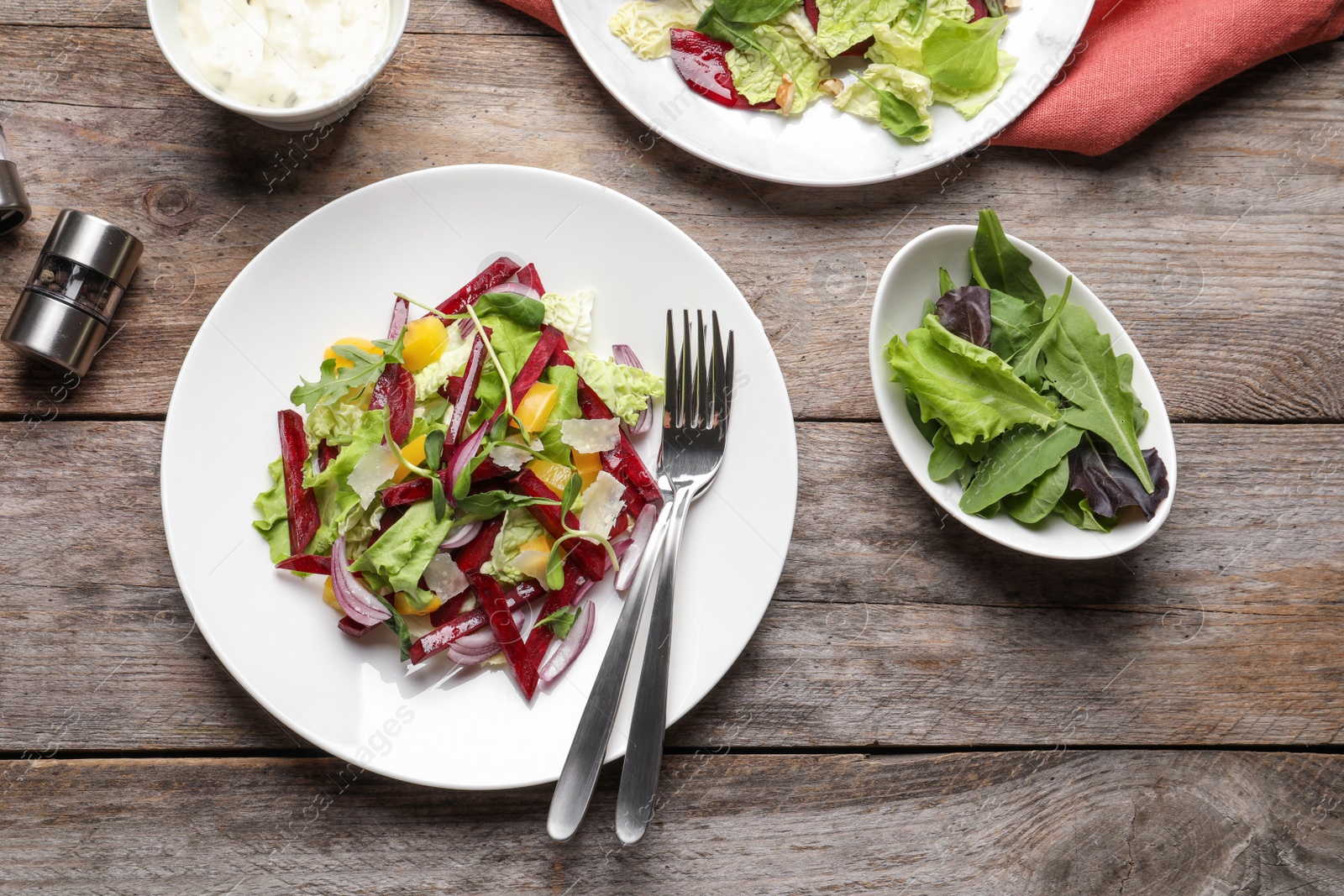 Photo of Delicious beet salad on wooden table, top view