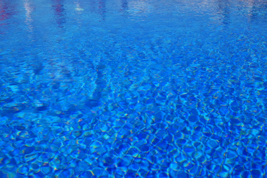 Photo of Outdoor swimming pool with clear water on sunny day
