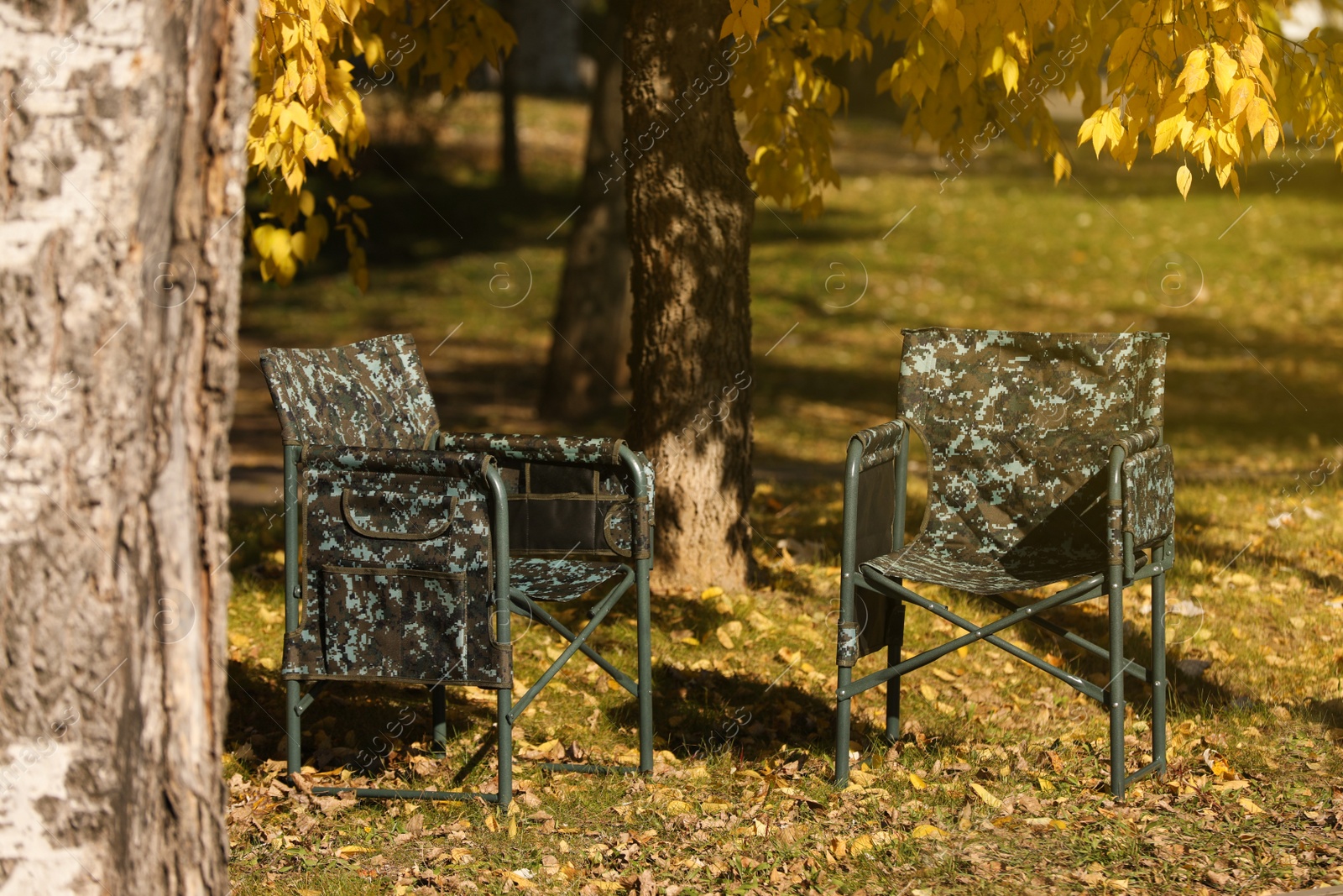 Photo of Pair of camping chairs in park on sunny day