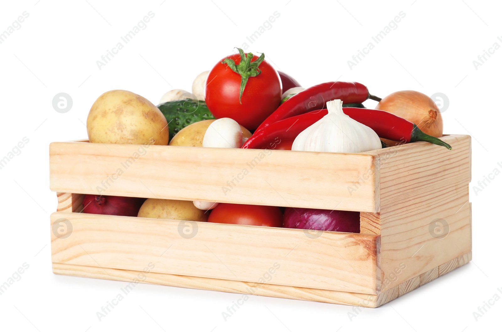 Photo of Wooden crate full of fresh vegetables on white background