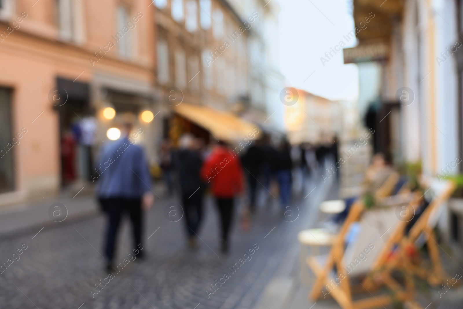 Photo of Blurred view of people walking on city street