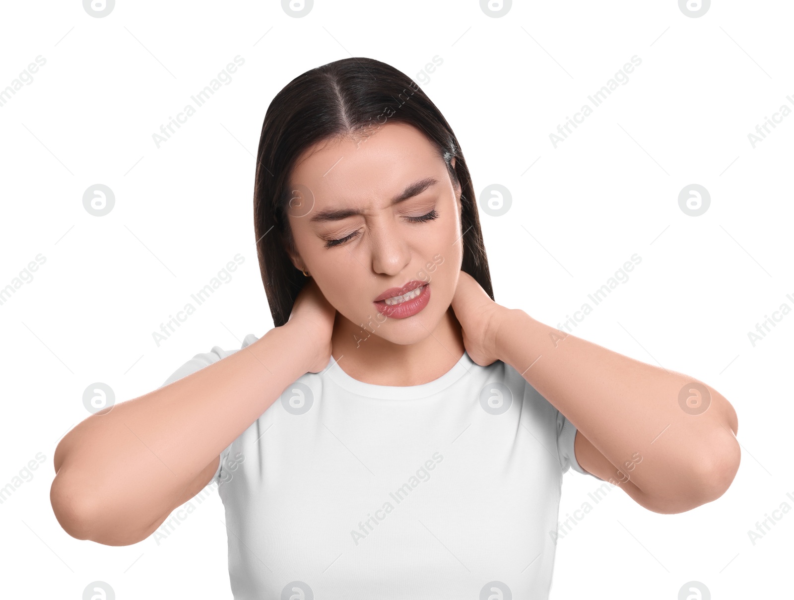 Photo of Young woman suffering from pain in neck on white background. Arthritis symptoms