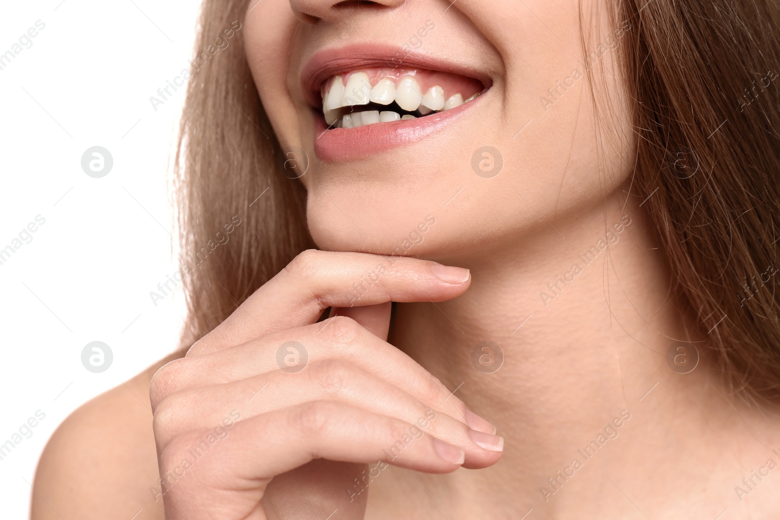 Photo of Young woman with beautiful smile on white background, closeup. Teeth whitening