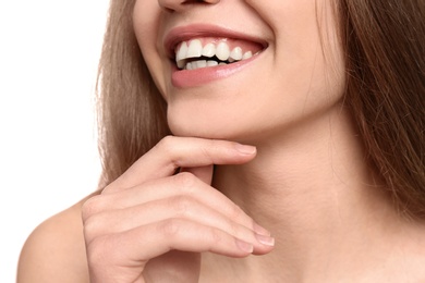 Young woman with beautiful smile on white background, closeup. Teeth whitening