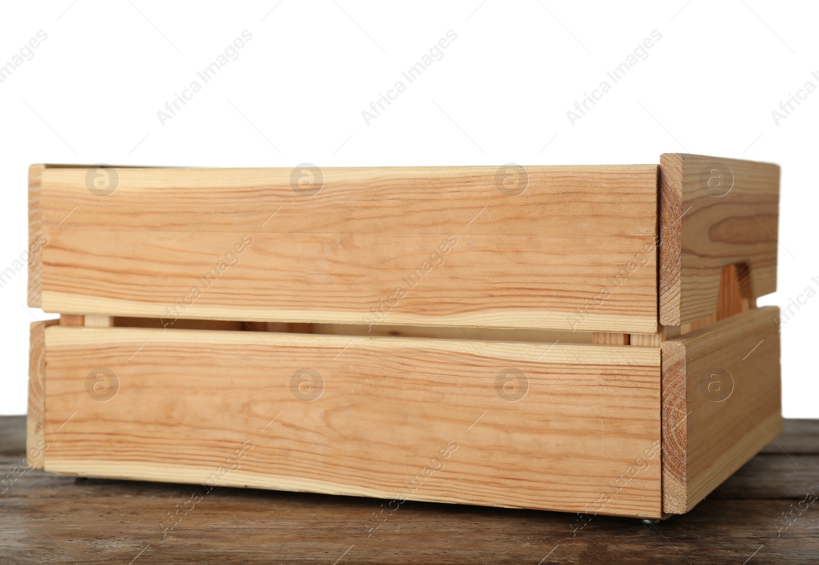 Photo of Empty rustic wooden crate on table against white background