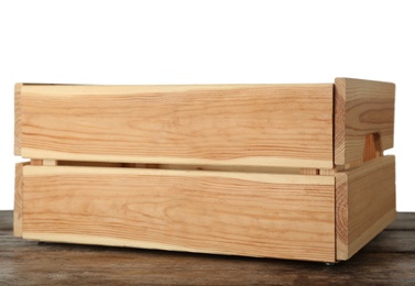 Photo of Empty rustic wooden crate on table against white background