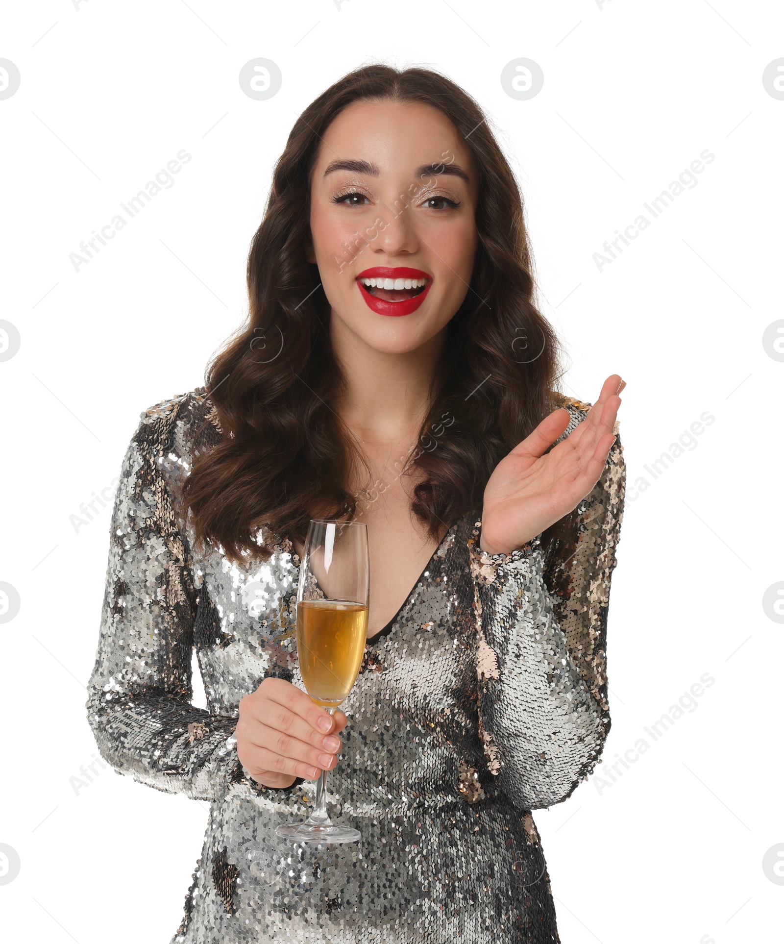 Photo of Christmas celebration. Beautiful young woman in stylish dress with glass of champagne isolated on white